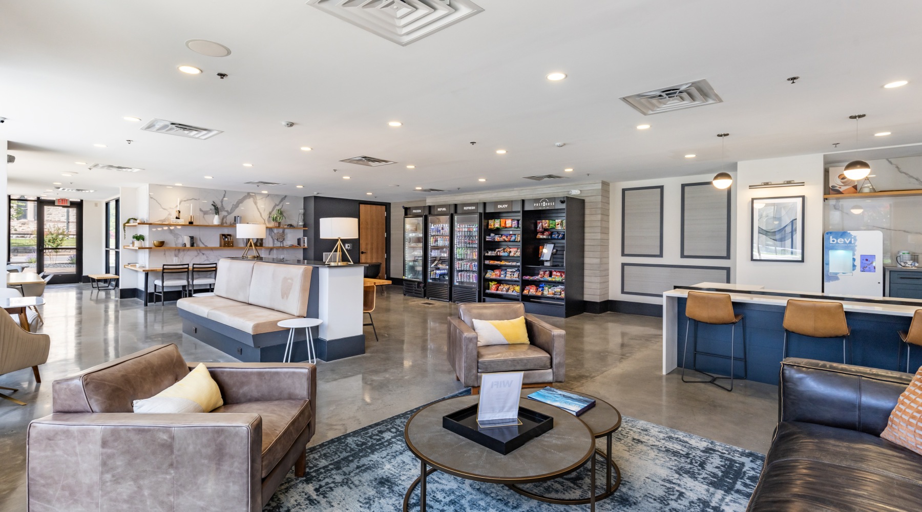 Clubhouse with blue furniture white walls 