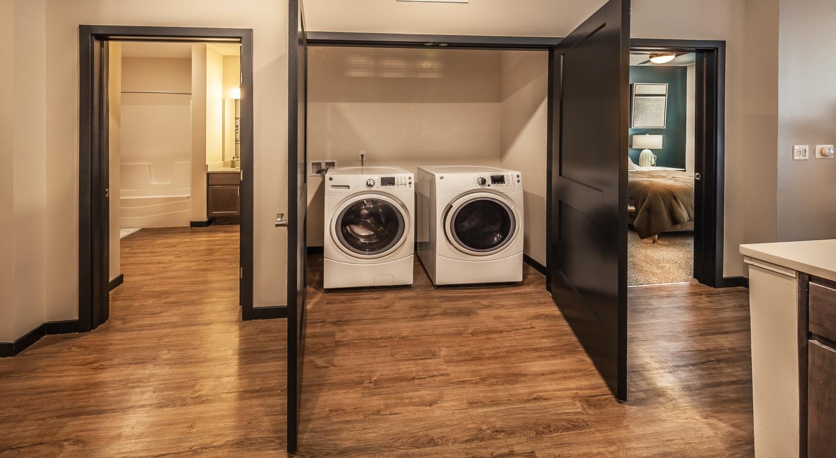 Settle into comfort at Post House laundry closet with side-by-side washer and dryer